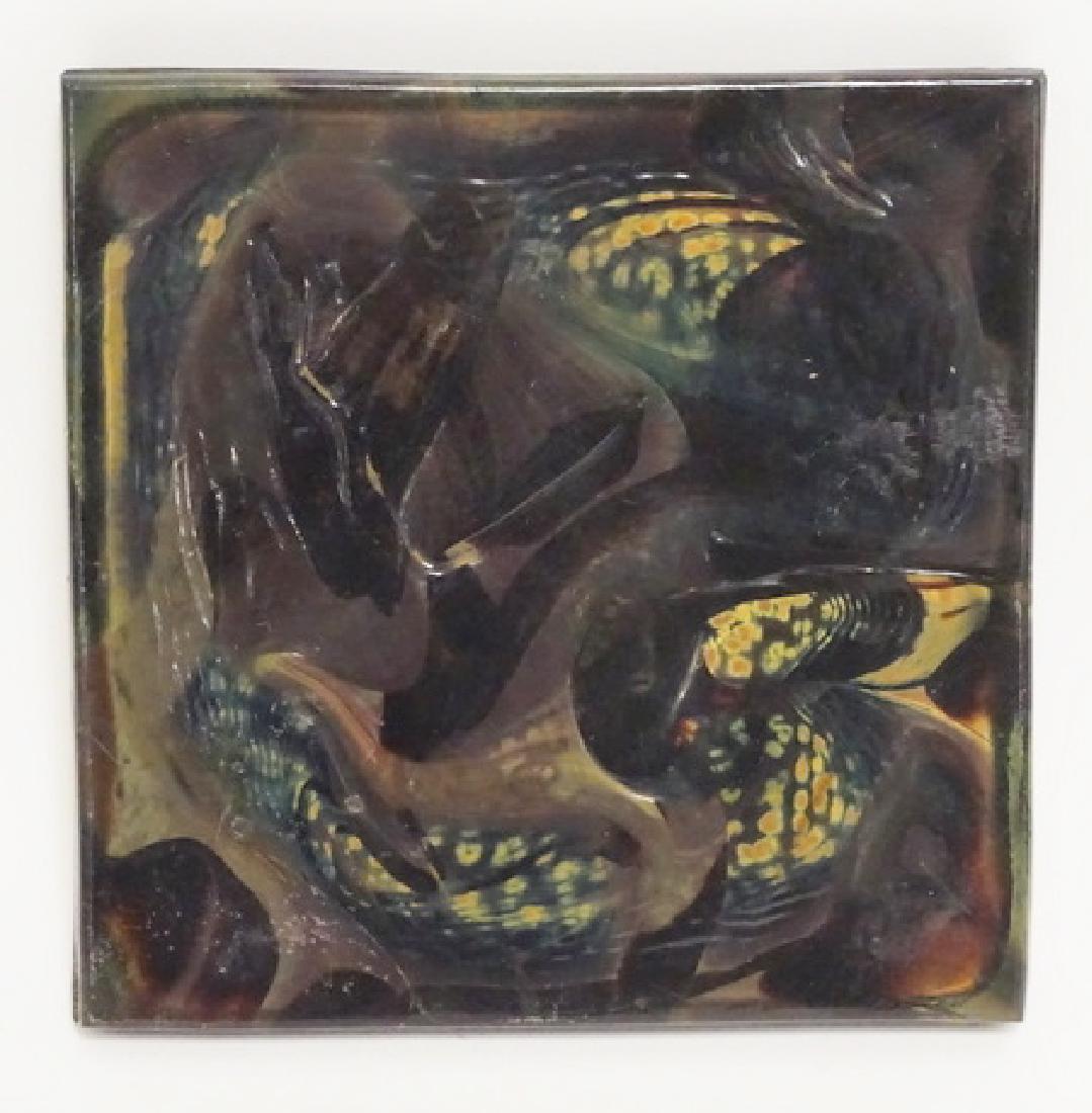 L.C. TIFFANY ART GLASS TILE: L.C. TIFFANY ART GLASS TILE. 4 INCHES SQUARE. RAISED LETTERING ON THE EDGE *PAT. APPLIED FOR*.