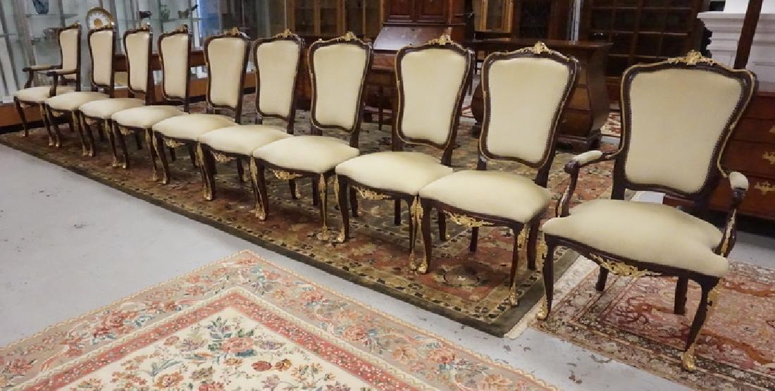 SET OF 10 DINING CHAIRS WITH GILT ORMOLU ACCENTS: SET OF 10 DINING CHAIRS WITH GILT ORMOLU ACCENTS. EACH CHAIR WITH LOSSES TO THE APPLIED ORMOLU.