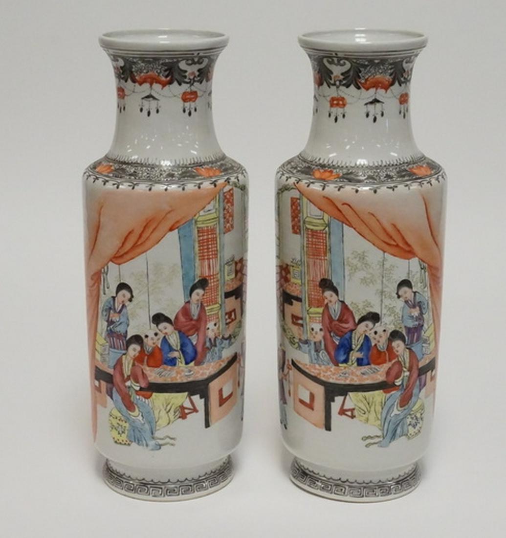 PAIR OF CHINESE PORCELAIN VASES: PAIR OF CHINESE PORCELAIN VASES. HAND PAINTED MIRROR IMAGES INCLUDING FIGURES, BATS, AND FLOWERS. SIGNED. 13 1/4 INCHES HIGH.