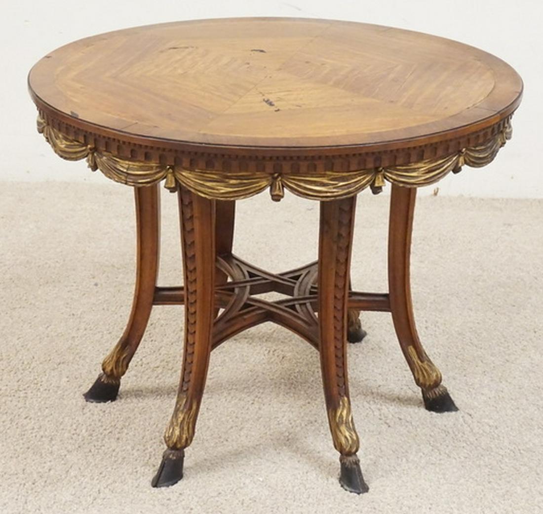 J.N. SLACK TABLE WITH CARVED DECORATION: J.N. SLACK TABLE FEATURING CARVED AND PARCEL GILT DECORATIONS ALONG WITH HOOF FEET. 26 INCH DIA. 20 INCHES HIGH. SOME LOSSES