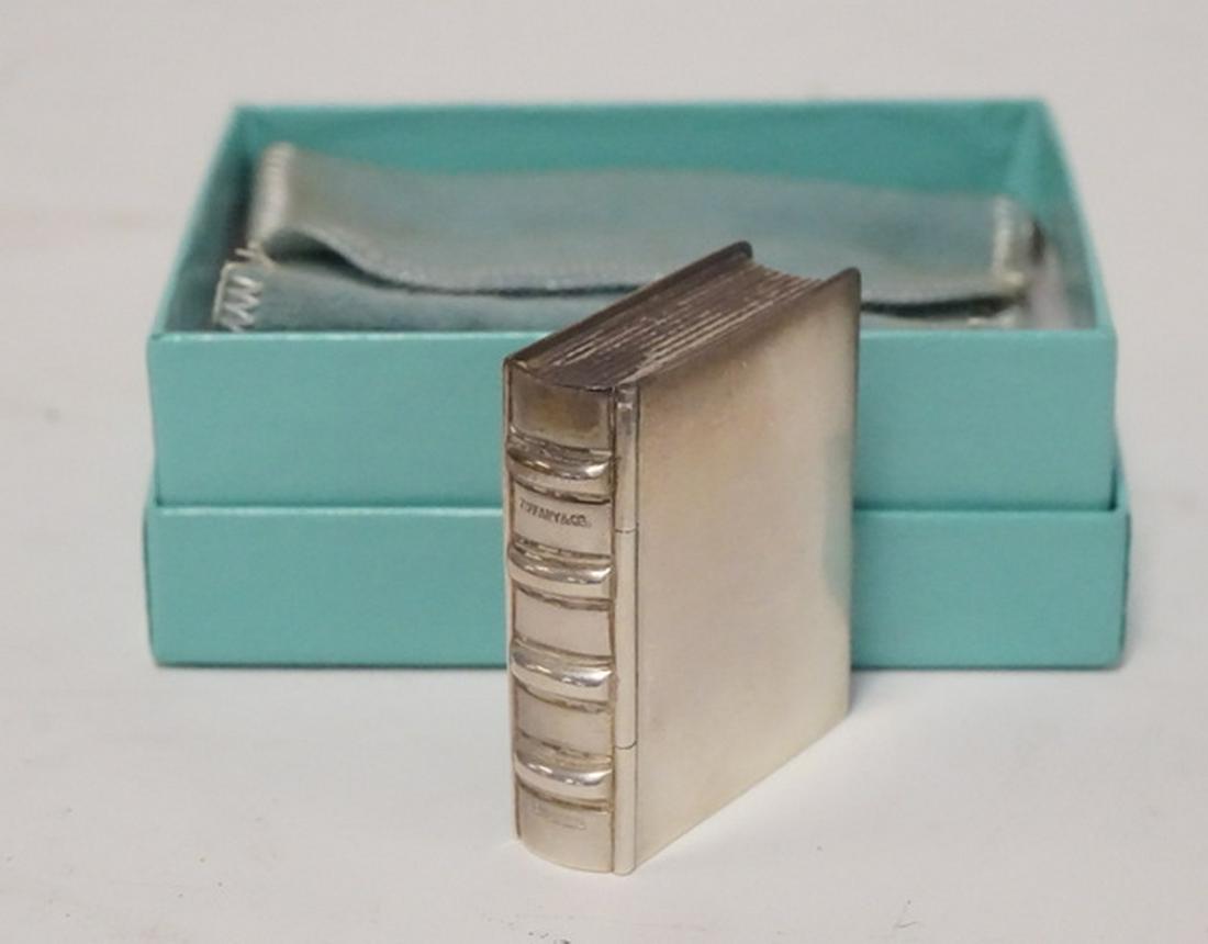 TIFFANY STELRING PILL BOX: TIFFANY & CO STERLING SILVER PILL BOX IN THE FORM OF A BOOK. 1.36 TROY OZ. 1 3/4 X 1 1/2 AND 1/2 INCH HIGH.