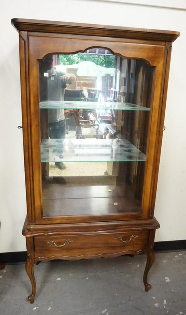 HEMMINGWAY CURIO CABINET: HEMMINGWAY CURIO CABINET. LIGHTED INTERIOR WITH GLASS SHELVES AND A MIRRORED BACK. 62 INCHES HIGH. 32 INCHES WIDE.