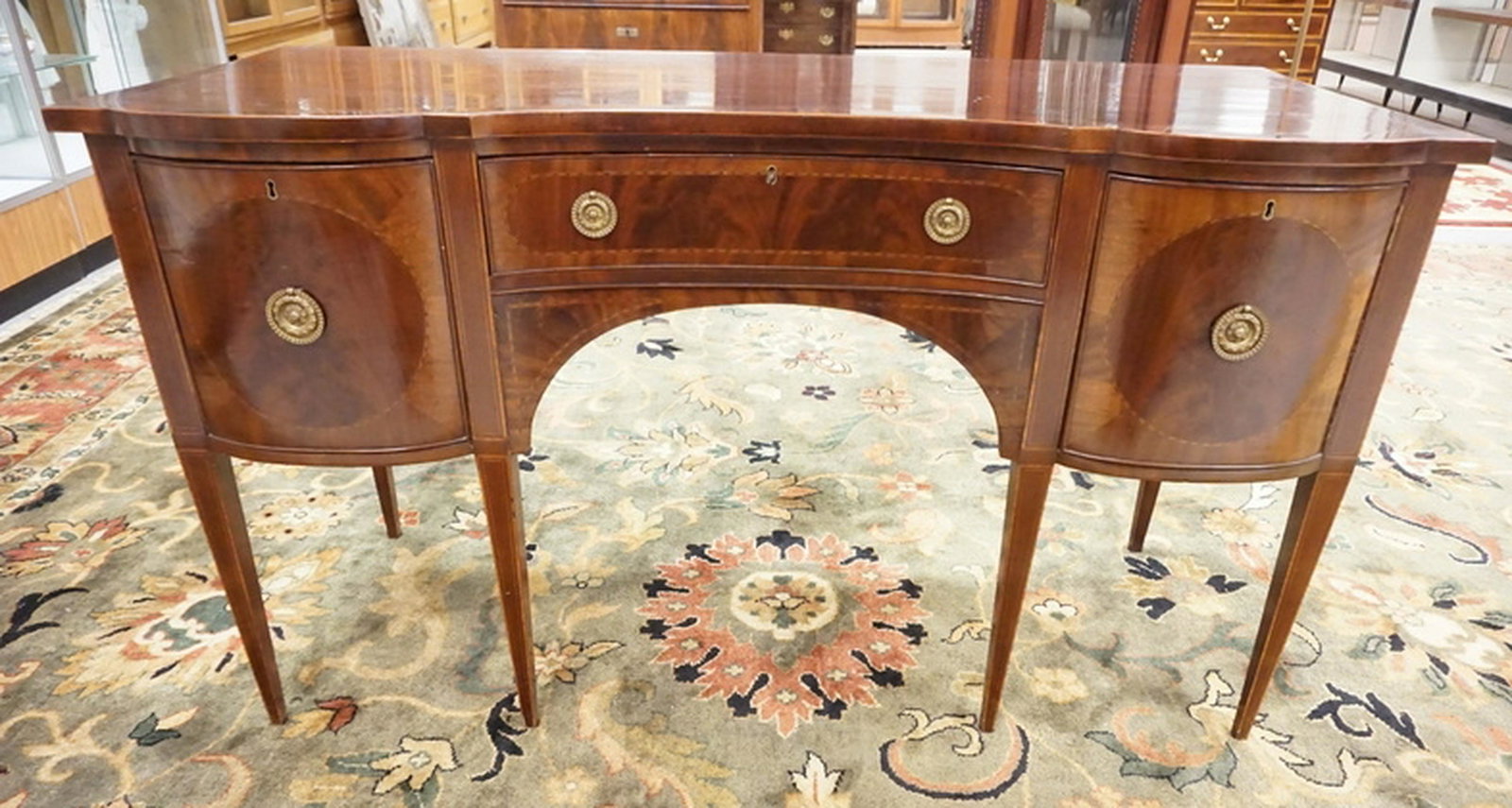 ANTIQUE MAHOGANY SIDEBOARD: ANTIQUE INLAID AND BANDED MAHOGANY SIDEBOARD. 60 1/4 INCHES WIDE. 34 1/4 INCHES HIGH.