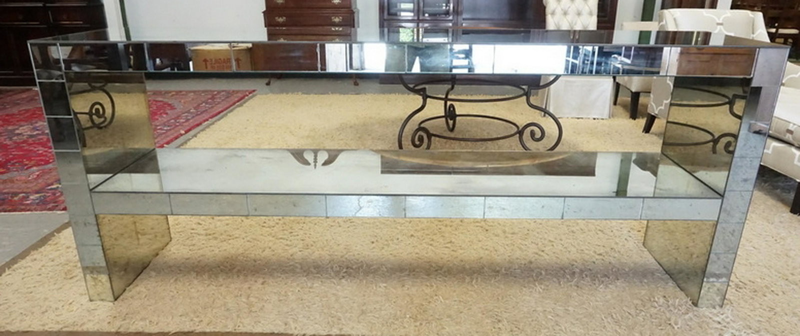 MIRRORED CREDENZA: MIRRORED CREDENZA COMPRISED OF 2 OPEN SHELVES. MIRRORED ON ALL SURFACES EXCEPT THE BACK. 90 1/2 INCHES WIDE. 20 1/2 INCHES DEEP. 36 1/2 INCHES HIGH.