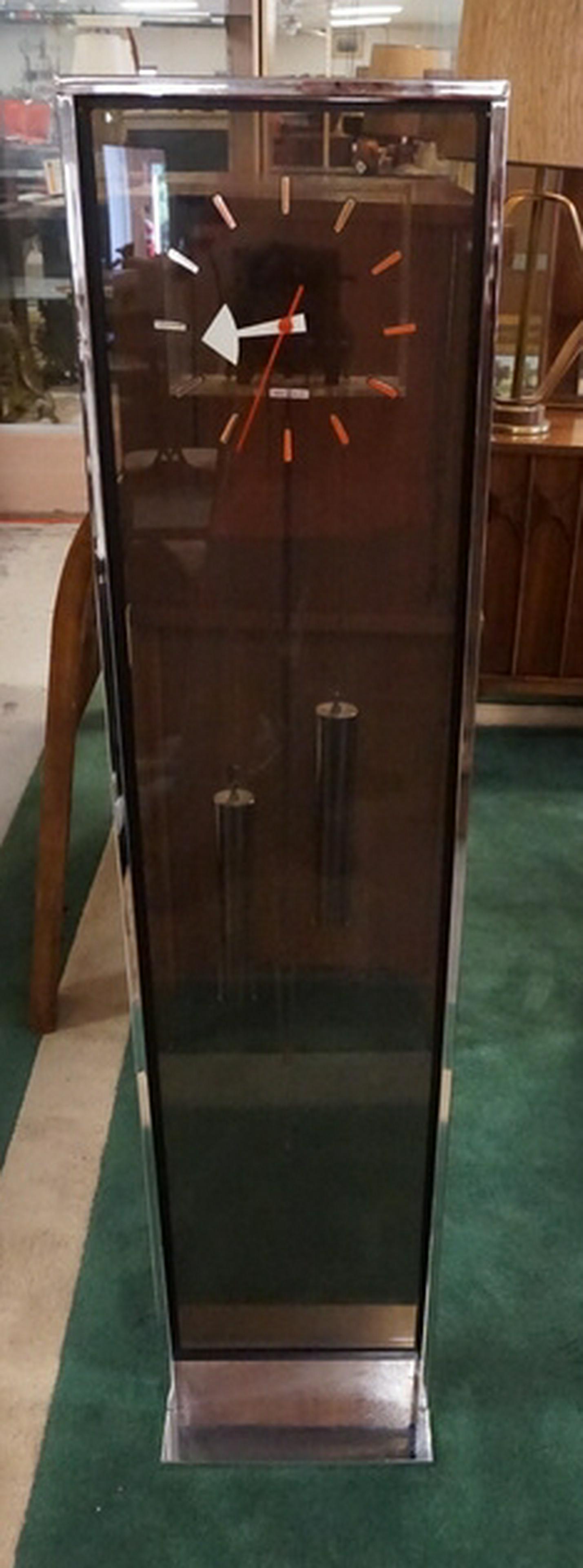 MID CENTURY MODERN HOWARD MILLER CLOCK: MCM HOWARD MILLER TALL FLOOR CLOCK. 56 INCHES HIGH. 13 INCHES WIDE.