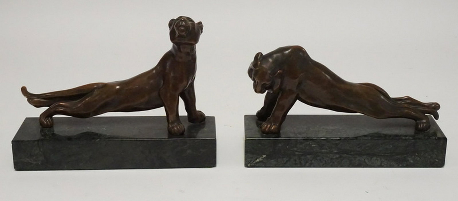 BRONZE JUNGLE CAT SCULPTURES: PAIR OF BRONZE JUNGLE CAT SCULPTURES ON MARBLE BASES. 9 1/2 INCHES LONG. ONE HAS A CHIP TO THE BACK CORNER OF THE BASE.