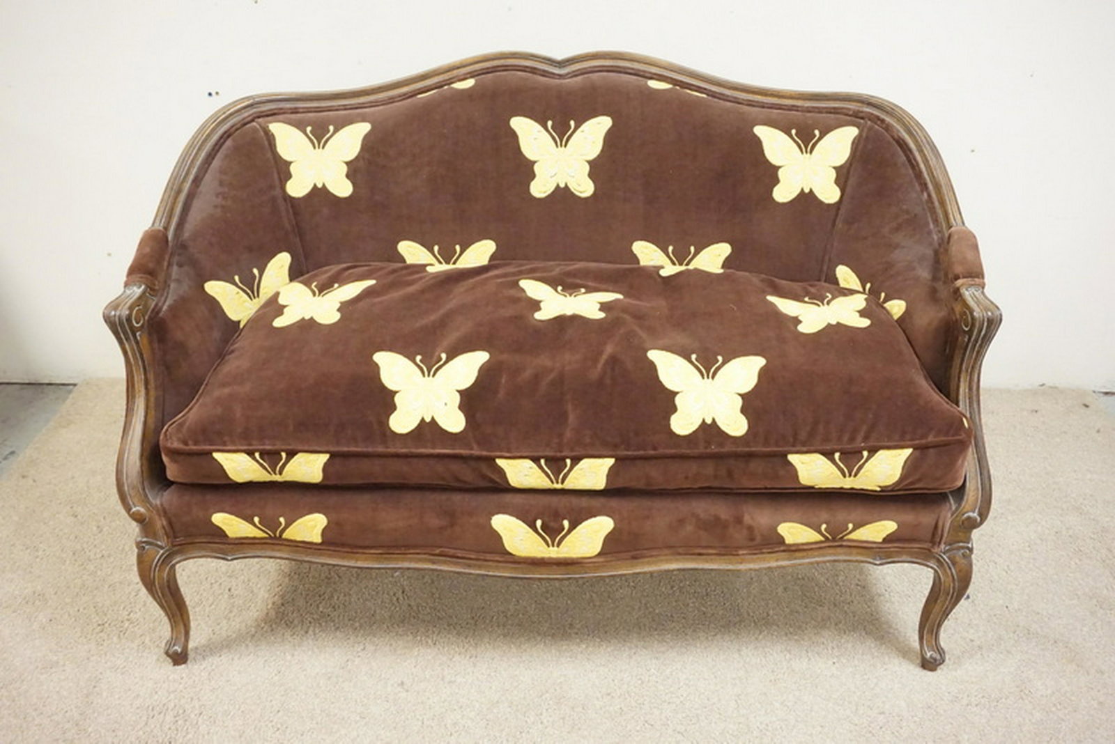 MEYER GUNTHER MARTINI SETTEE: MEYER GUNTHER MARTINI SETTEE WITH BUTTERFLY UPHOLSTERY. 53 INCHES WIDE.