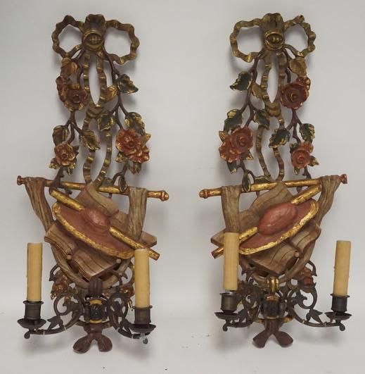 PAIR OF CARVED AND PAINT DECORATED SCONCES: PAIR OF CARVED AND PAINT DECORATED WOODEN SCONCES. 25 X 10 1/4 INCHES.