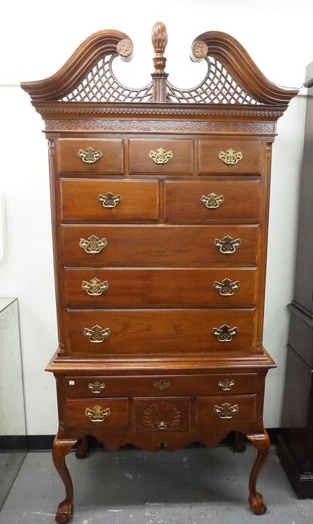 AMERICAN DREW HIGHBOY: AMERICAN DREW AMERICAN INDEPENDENCE COLLECTION HIGH BOY WITH BALL AND CLAW FEET. HAS A BROKEN ARCH TOP WITH CARVED LATTICE. 81 1/2 IN H, 39 3/4 IN WIDE