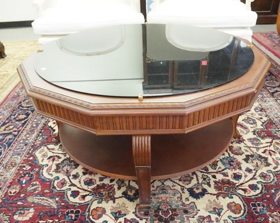 ETHAN ALLEN COFFEE TABLE: ETHAN ALLEN COFFEE TABLE WITH A BLACK GLASS TOP. 43 1/2 INCHES WIDE. 20 1/2 INCHES HIGH.