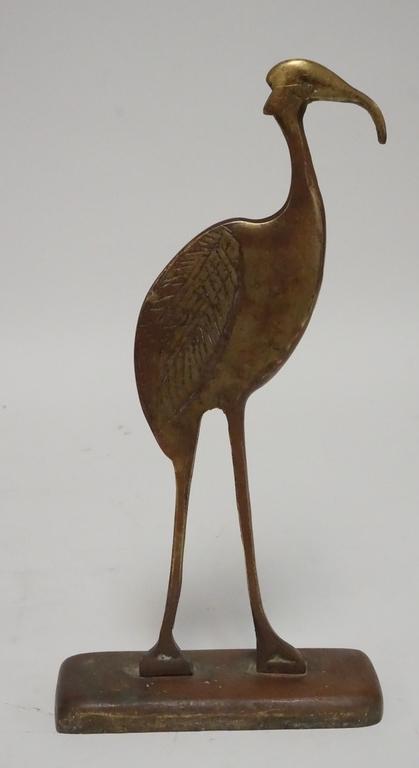 BRONZE DOORSTOP: FIGURAL BRONZE DOORSTOP IN THE FORM OF AN IBIS. 14 INCHES HIGH.