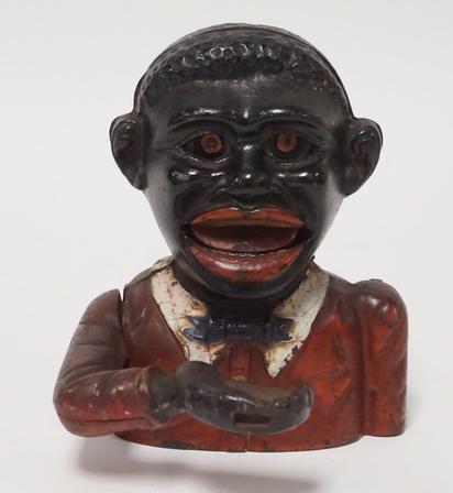 LITTLE JOE MECHANICAL BANK: LITTLE JOE CAST IRON MECHANICAL BANK. 5 1/4 INCHES HIGH.