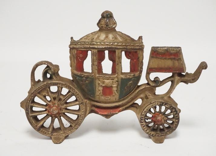 CAST IRON CARIAGE DOORSTOP: CAST IRON CARRIAGE DOORSTOP. 8 3/4 INCHES HIGH.