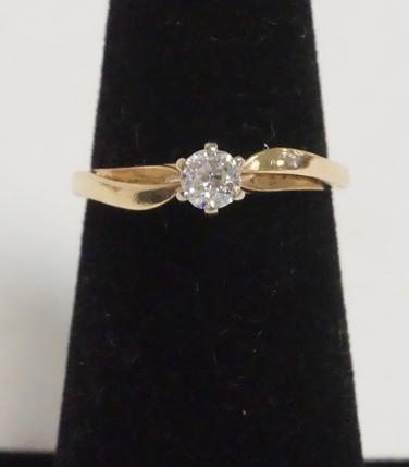 14K DIAMOND SOLITAIRE RING: 14K YELLOW GOLD DIAMOND SOLITAIRE RING. .15 CT. APPROX SIZE 4 1/2. 1.35 DWT.