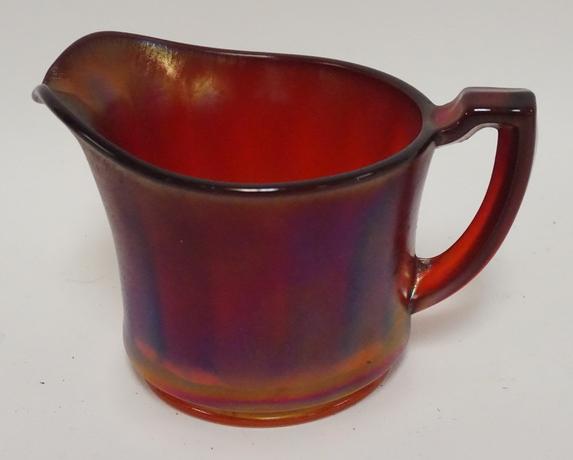 DEEP RED STRETCH GLASS CREAMER: DEEP RED STRETCH GLASS CREAMER WITH INTERIOR RIBS. 3 1/2 IN H