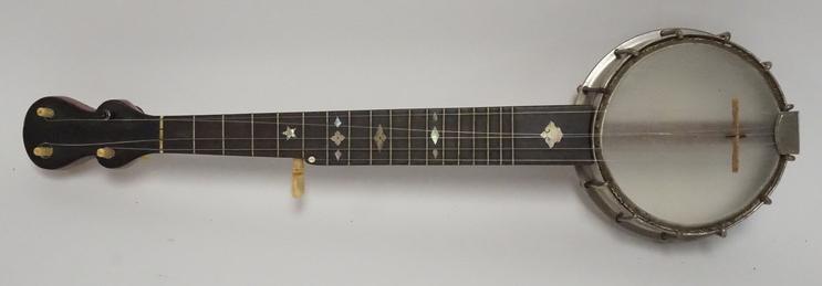 BANJO UKULELE: BANJO UKULELE WITH A MOTHER OF PEARL INLAID NECK. 24 INCHES LONG.