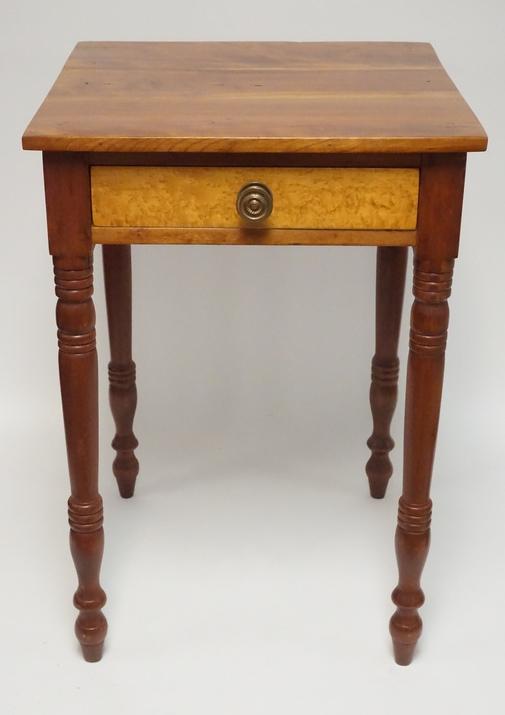 ANTIQUE ONE DRAWER STAND: ANTIQUE ONE DRAWER STAND WITH TURNED LEGS AND A BIRDSEYE MAPLE DRAWER FRONT. 27 1/2 INCHES HIGH. 19 INCHES WIDE.