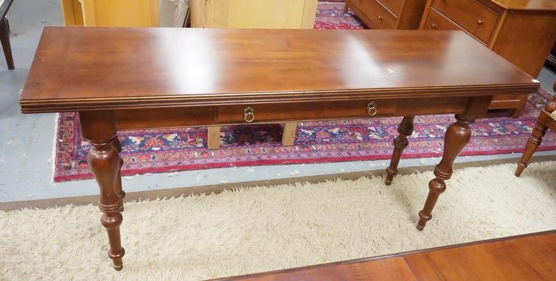ETHAN ALLEN FLIP TOP TABLE WITH TURNED LEGS.: ETHAN ALLEN FLIP TOP TABLE WITH TURNED LEGS. 66 INCHES LONG. 31 1/2 INCHES HIGH. 19 INCHES DEEP,