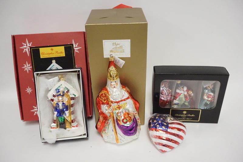 RADKO CHRISTMAS ORNAMENTS: GROUP OF CHRISTOPHER RADKO CHRISTMAS ORNAMENTS. INCLUDES A LARGE SANTA, A 2000 NUTCRACKER, A STARS AND STRIPES HEART, AND A 1995 NUTCRACKER SUITE.