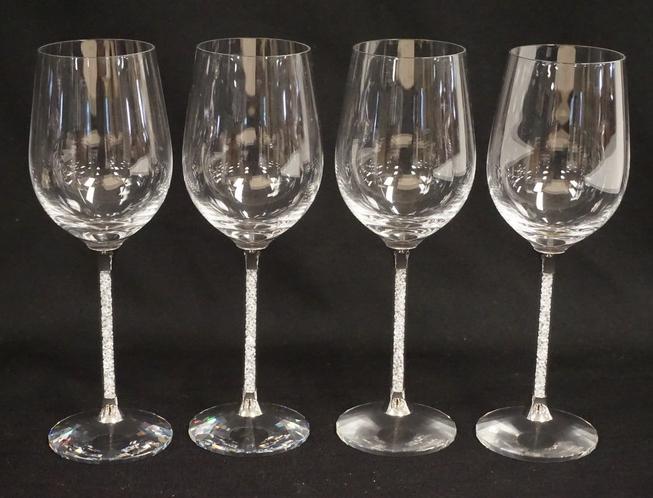 SWAROVSKI: SET OF 4 STEVEN WEINBERG FOR SWAROVSKI CRYSTAL WINE GLASSES. 9 INCHES HIGH.