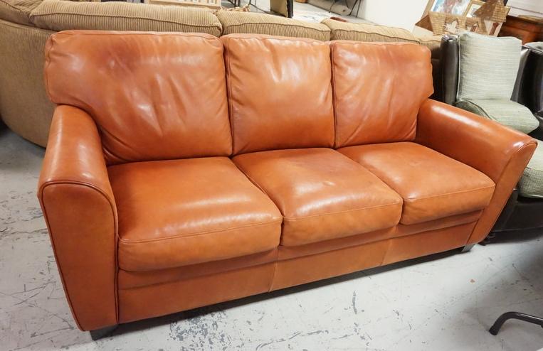 LEATHER SOFA: LEATHER SOFA. HAS SOME WEAR. 79 IN WIDE.