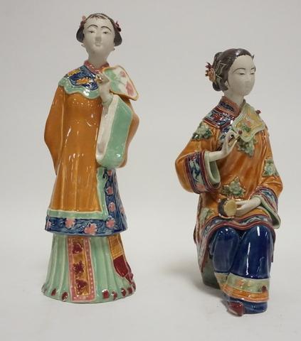 ASIAN FIGURES: PAIR OF PORCELAIN ASIAN FIGURES WITH INCISED SIGNATURE INSIDE. SMALL BREAK ON WOMANS DRUM TRIM. TALLEST IS 11 3/4 IN.