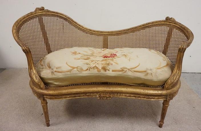 GILT DECORATED AND CARVED CANE BACK AND BOTTOM SET: GILT DECORATED AND CARVED CANE BACK AND BOTTOM SETTEE W/ CUSHION