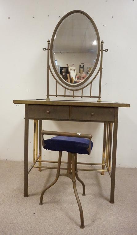 BRASS VANITY: BRASS VANITY W/ GLASS TOP AND BEVELED MIRROR WITH SWIVEL CHAIR. ONE LOWER BRASS RAIL MISSING.