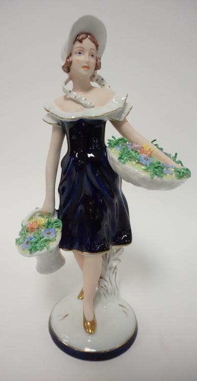 ROYAL DUX FIGURE: ROYAL DUX FIGURE OF A LADY WITH FLOWER BASKETS 10 1/2 IN H