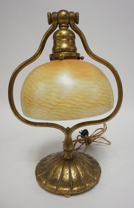 TIFFANY STUDIOS GOLD DORE BELL LAMP W/ FAVRILE GLASS: TIFFANY STUDIOS GOLD DORE BELL LAMP W/ FAVRILE SHADE, SHADE IS CRACKED, BASE IS SIGNED TIFFANY STUDIOS NEW YORK 419 SHADE IS SIGNED LCT, 13 1/4 IN H