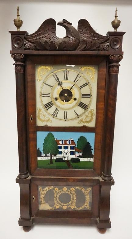 ANTIQUE FORESTVILLE 8 DAY PILLAR SHELF CLOCK: ANTIQUE FORESTVILLE 8 DAY PILLAR SHELF CLOCK. 17 3/4 IN WIDE, 40 IN H CARVED EAGLE CREST