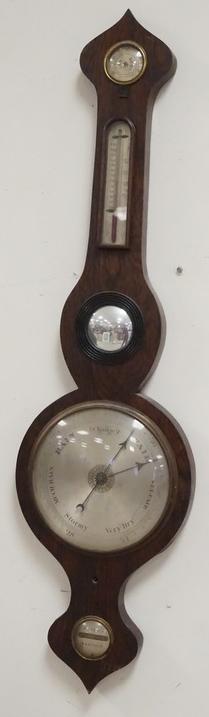 N. REED HASTINGS BAROMETER: N. REED HASTINGS BAROMETER, HAS A BULLS EYE MIRROR IN THE CENTER, 37 1/2 IN H