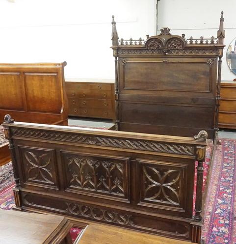 HEAVILY CARVED GOTHIC BED: HEAVILY CARVED GOTHIC BED, HAS CARVED TWIST FULL COLUMNS & AND STEEPLE FINIALS ON THE HEADBOARD. RAILS NOT ORIGINAL