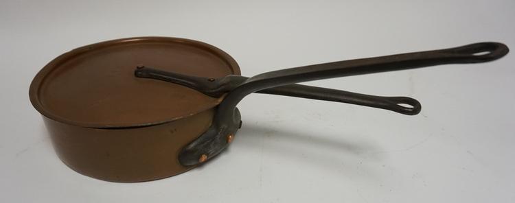 COPPER COVERED PAN WITH CAST IRON HANDLES: TIN LINED COPPER COVERED PAN WITH CAST IRON HANDLES. 10 IN DIAMETER. LID DIE STAMPED C I A