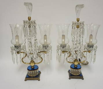 PAIR OF CRYSTAL LAMPS WITH PRISMS: PAIR OF CRYSTAL LAMPS WITH CUT HURRICANE SHADES, CUT PRISMS, BLUE GLASS DECORATION AND GLASS PLUME CRESTS. 21 1/2 IN H. ONE CORD IS CUT