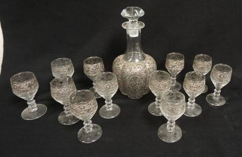 ETCHED DECANTER WITH 12 WINES: FLORAL ETCHED DECANTER WITH 12 MATCHING STEMS. ORIGINAL STOPPER. DECANTER IS 10 IN H