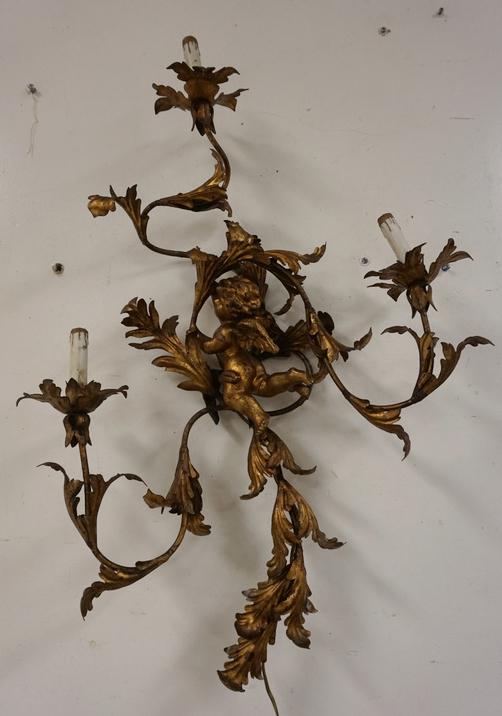 3 LIGHT WALL SCONCE: ORNATE 3 LIGHT WALL SCONCE WITH CHERUB. ARMS AND LEAVES ARE IRON. ELECTRIFIED. 35 IN H, 25 IN WIDE