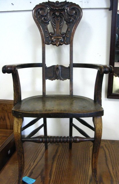 CARVED OAK ARM CHAIR -NORTHWIND, SOME DAMAGE AT T