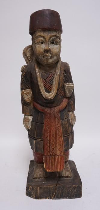 LARGE ASIAN WOOD CARVING: LARGE ASIAN PAINTED WOOD CARVING, A MAN CARRYING A CHILD ON HIS BACK, THERE IS A SPLIT ON THE BASE, 24 1/2 IN H