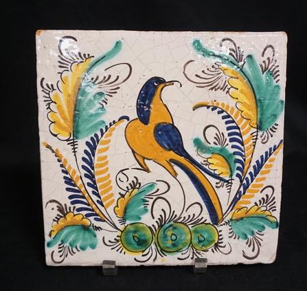 LARGE HP TILE: LARGE HAND PAINTED TILE W/ BIRD & FOLIAGE, HAS A SMALL CHIP IN UPPER LEFT-HAND CORNER, 9 7/8 IN X 9 3/4 IN