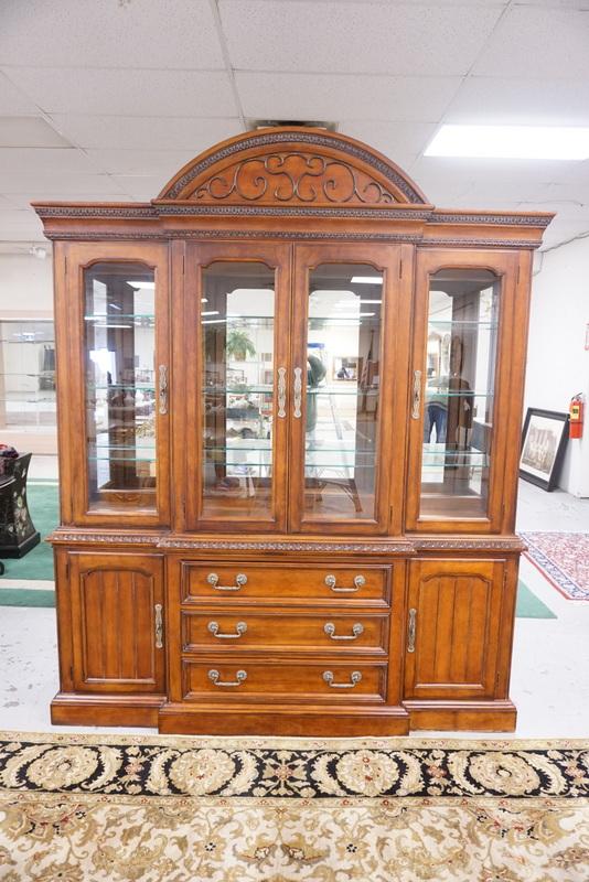 HICKORY WHITE 2 PC BREAKFRONT: HICKORY WHITE 2 PC BREAKFRONT. HAS LIGHTING, MIRROR BACK, GLASS SHELVES AND SILVER DRAWER