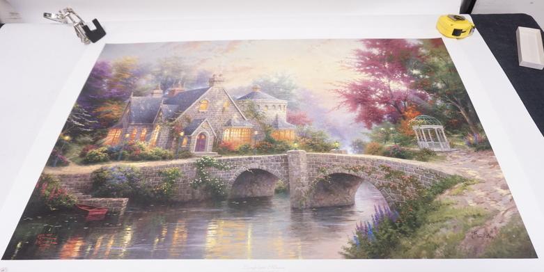 THOMAS KINKADE UNFRAMED PRINT *LAMPLIGHT MANOR*: THOMAS KINKADE UNFRAMED PRINT *LAMPLIGHT MANOR*. COMES WITH CERTIFICATE OF AUTHENTICITY. 39 IN X 27 IN
