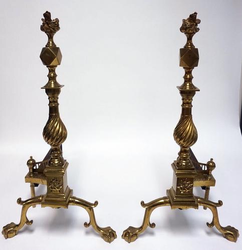 PAIR OF ORNATE BRASS ANDIRONS: PAIR OF BRASS ANDIRONS WITH BALL AND CLAW FEET, FLAME FINIALS AND SWIRL POSTS. HEAVY AND WELL MADE. 24 3/4 IN H, 23 IN LONG
