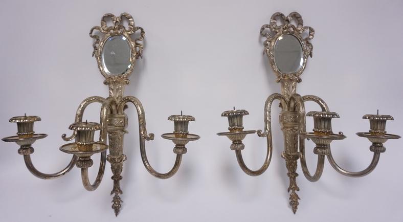 PR OF SILVER PLATED PRICKET SCONCES W/BEVELED MIRRORS: PAIR OF SILVER PLATED 3 LIGHT PRICKET SCONCES WITH OVAL BEVELED MIRRORS. 19 IN H, 15 IN WIDE