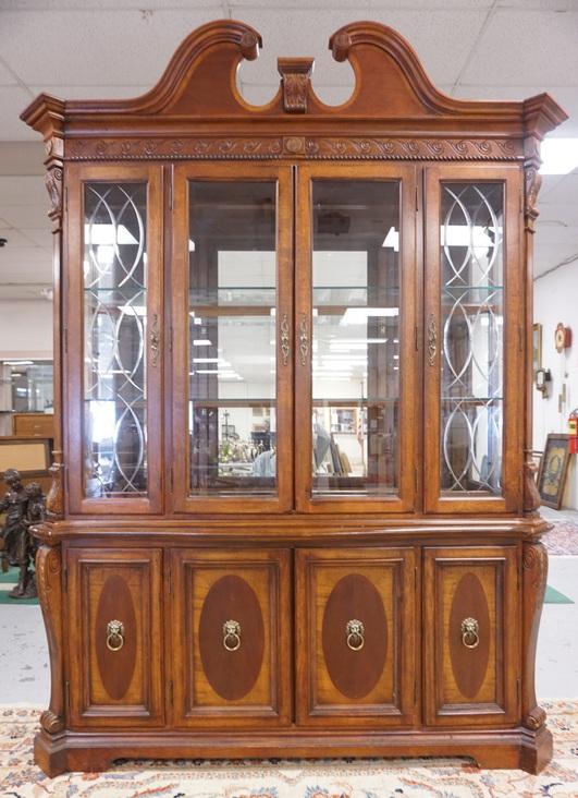 2 PC CARVED BREAKFRONT: TWO PIECE CARVED BREAKFRONT, TWO FRONT PANELS HAVE CUT DESIGN, HAS MIRROR BACK GLASS SHELVES & LION HEAD PULLS ON THE DOORS
