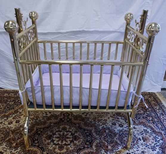 BRASS SWINGING CRADLE: BRASS SWINGING CRADLE W/ CANNON BALL FINIALS