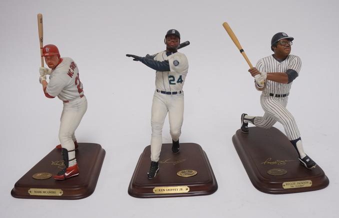 GRP OF 3 DANBURY MINT BASEBALL FIGURES: GROUP OF THREE DANBURY MINT BASEBALL FIGURES MARK MCGWIRE, KEN GRIFFEY JR. & REGGIE JACKSON, FRONT OF JACKSONS CAP IS CHIPPED, TALLEST IS 9 3/4 IN