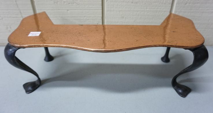 CAST IRON FIREPLACE TRIVET: CAST IRON FIREPLACE TRIVET, TOP SURFACE IS COVERED W/ SHEET COPPER, 16 IN W, 5 IN H