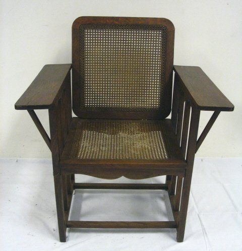 UNUSUAL MISSION OAK ARM CHAIR; HAS CANED SEAT & BA