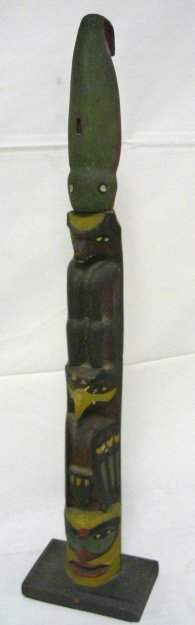 HAND CARVED WOODEN TOTEM POLE; THERE IS A RECTANGU